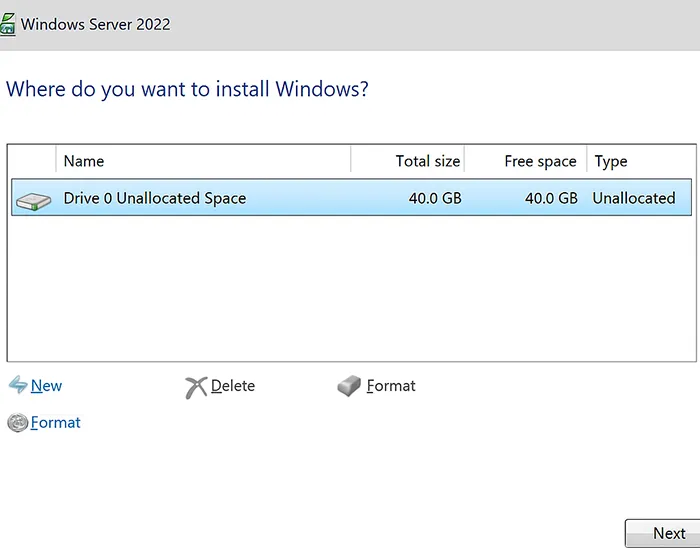 Windows Server 2022 disk partition screen with unallocated space and Next button